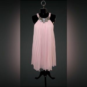 Accordion, knee length cocktail dress with jeweled neckline.
